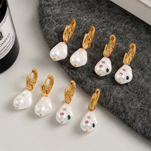 Detailed shot of gold-plated baroque pearl earrings with colorful inlaid rhinestones.