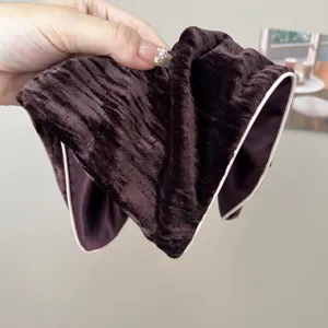 Close-up detail showing the rich brown velvet texture of this retro sponge headband