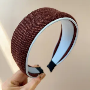 Macro detail of elegant brown woven tweed wide headband showcasing high-quality fabric