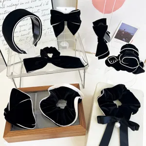 Elegant black velvet hair accessory set featuring headbands, bow clips and scrunchies.