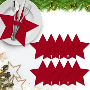 Detailed macro view of red felt star shaped cutlery holders for Christmas dining table