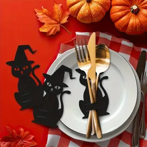 Halloween black cat cutlery holder detail showing cat-shaped pocket for gold utensils