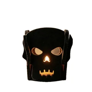 Bougeoir Halloween en feutre noir avec motif crâne ajouré pour déco fête