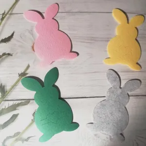 Detail of bunny felt cutlery holders in four colors for Easter table decorations