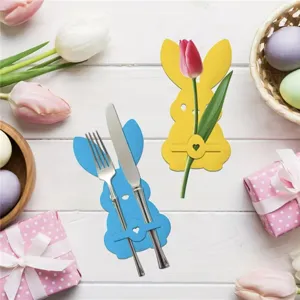 Cute rabbit-shaped cutlery holder detail for festive Easter table decorations with flowers