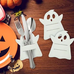 White ghost cutlery holder for Halloween party table decoration with knife and fork