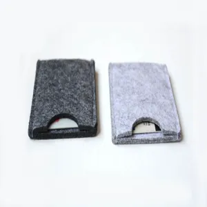 Close-up detail view of grey felt card sleeves showing soft texture and half-moon opening
