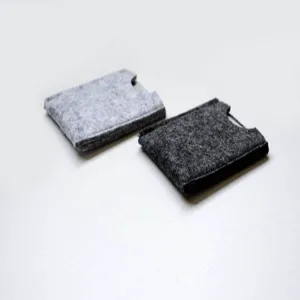 Detailed view of grey felt card pouches showing two different shades and textures