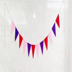 Macro detail of colorful non-woven fabric triangle bunting banner for party decoration