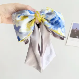 Large satin bow hair tie with elegant blue and yellow oil painting smudge pattern