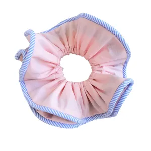 Premium large pink fabric scrunchie with blue striped edges and double-layer ruffled design