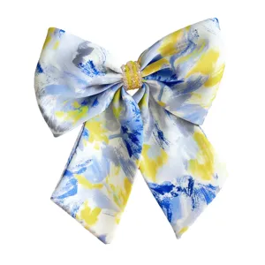 Elegant large hair bow with blue and yellow oil painting pattern and beaded center