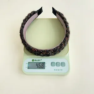 Detail view showing the 46.8g weight of this multicolored knitted braided wide headband