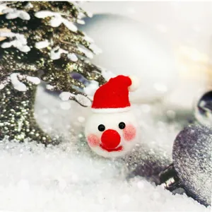 Handmade wool felt snowman with Santa hat for Christmas DIY crafts and decorations