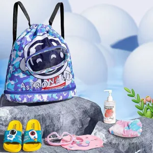 Kids waterproof drawstring swim bag, blue astronaut camo beach backpack for swimming and travel.