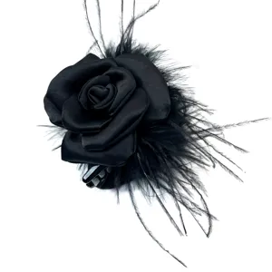 Elegant black satin rose hair claw clip with ostrich feathers on white background.