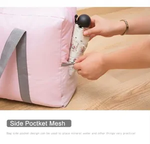 Detailed shot showing the side mesh pocket design of the large capacity travel storage bag.