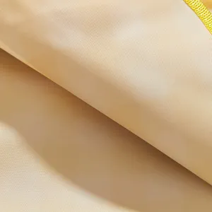 Waterproof picnic mat detail fabric texture close up beige outdoor camping blanket