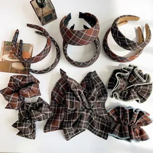Collection of vintage brown plaid hair accessories featuring padded headbands and ruffled scrunchies