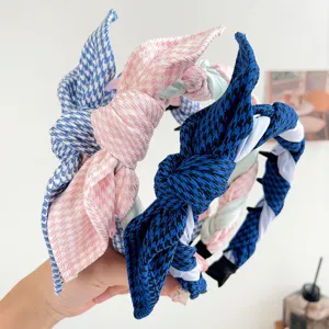 Detail of twisted houndstooth headbands with bunny ear knot and inner comb