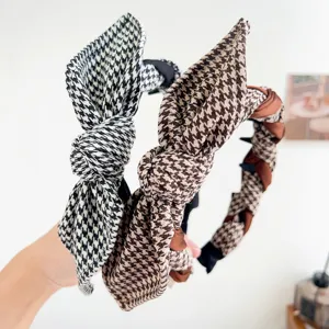 Detailed view of vintage houndstooth headbands featuring bunny ear knots and braided designs