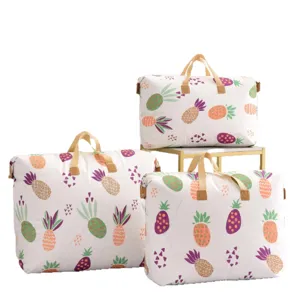Large capacity storage bag for clothes and quilts, thick fabric organizer with cute pineapple print.