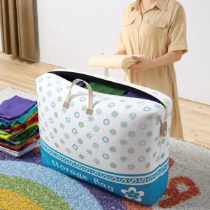 Large capacity storage bag with floral print, sturdy handles and zipper for home organization.