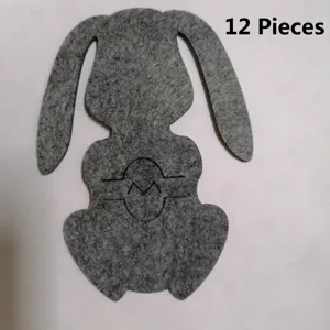 Detailed macro view showing the texture of a grey felt bunny-shaped table placemat