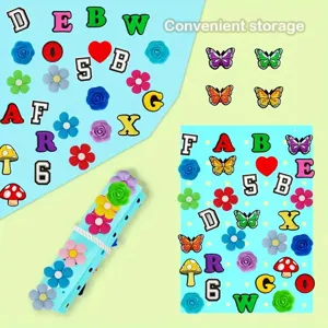 Close-up of blue felt brooch organizer strip showing colorful alphabet and flower charms