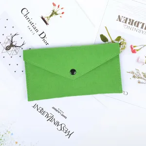 Detailed view of the bright green felt envelope storage pouch with a snap button closure