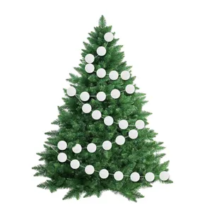 White wool ball garland wrapped around a green Christmas tree for holiday party decor