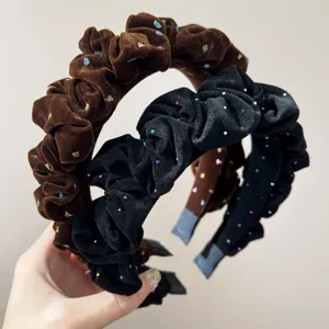 Close-up of ruffled flocking headbands with colorful glitter starry sky pattern