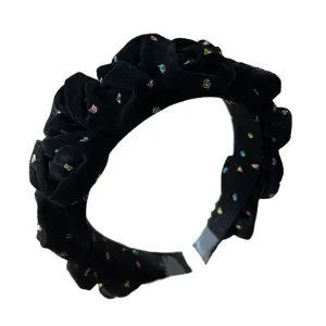 Black velvet pleated headband with colorful starry dots for high cranial top look.