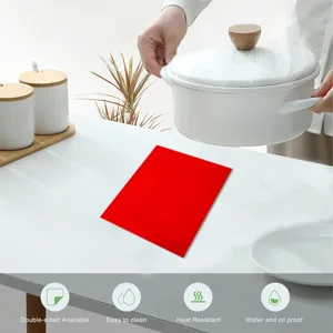 Detailed kitchen scene showing a red felt heat resistant table mat under a white pot