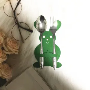Detail view of a green bunny felt cutlery bag for Easter table setting decorations.