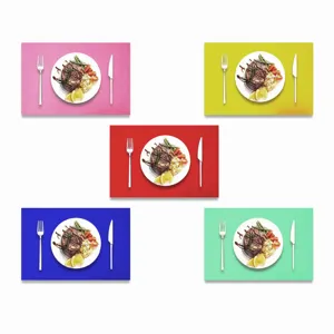 Five colorful felt placemats in pink yellow red blue and green for festive table decor