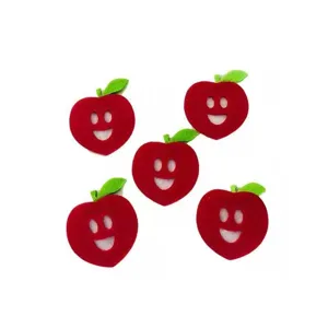 Detailed view of red non-woven felt apple craft pieces with cute smiley faces