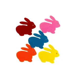 Detail view of colorful rabbit felt craft decorations for DIY projects.