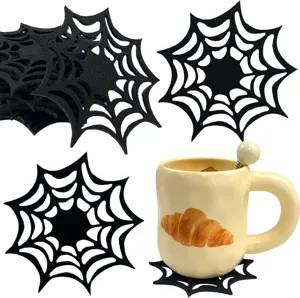 Black felt spider web coaster shown under a cream ceramic mug for Halloween decor