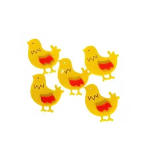 Macro view of five yellow chick felt fabric ornaments for DIY craft decorations