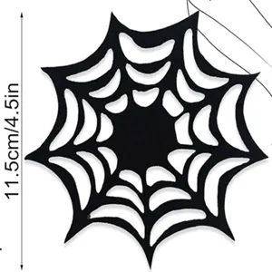 Close-up of black felt spider web placemat with dimension detail for Halloween