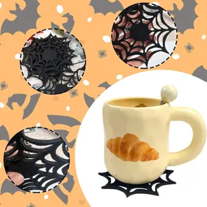 Detail view of black felt spiderweb coaster for Halloween party table decor.