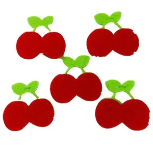 Detailed view of five cute red cherry felt decorations for DIY craft projects