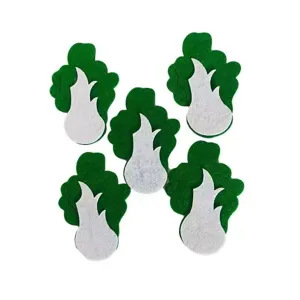 Macro detail of decorative green and white non-woven felt plant-shaped cutouts