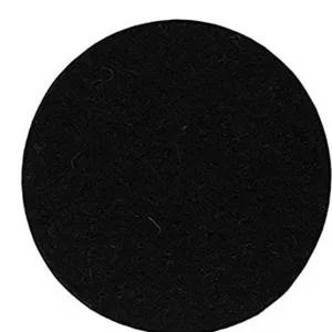 Macro view of a black circular felt plant coaster showing dense fiber texture and finish