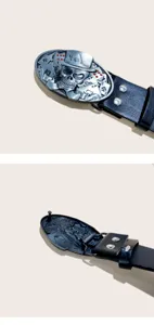 Detailed close-up of the vintage skull and poker playing cards metal belt buckle.