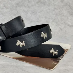 Black leather belt with silver dog stud rivets, vintage punk style, perfect for jeans and dresses.