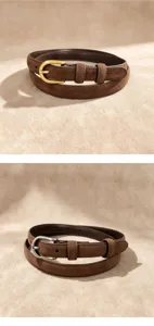 Brown genuine leather belt detail shot showing fine stitching and metal pin buckle design.