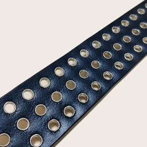 Punk style black leather belt featuring multiple rows of metal grommets for casual wear.