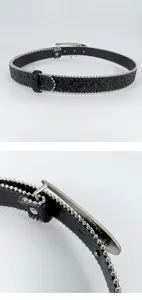 Detailed view of black glitter belt showcasing silver ball chain trim and metal buckle.